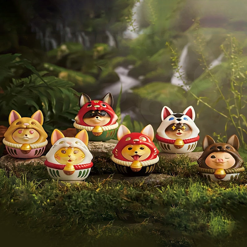 Set of fox-themed figurines with colorful hats in a forest setting