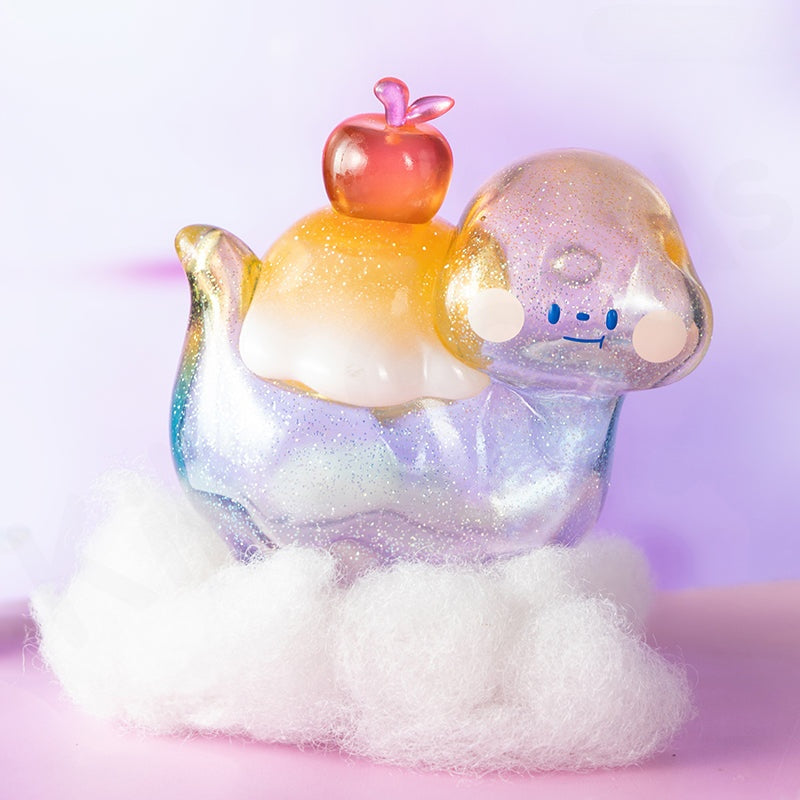 Colorful figurine with a small apple on a white cloud against a light purple background