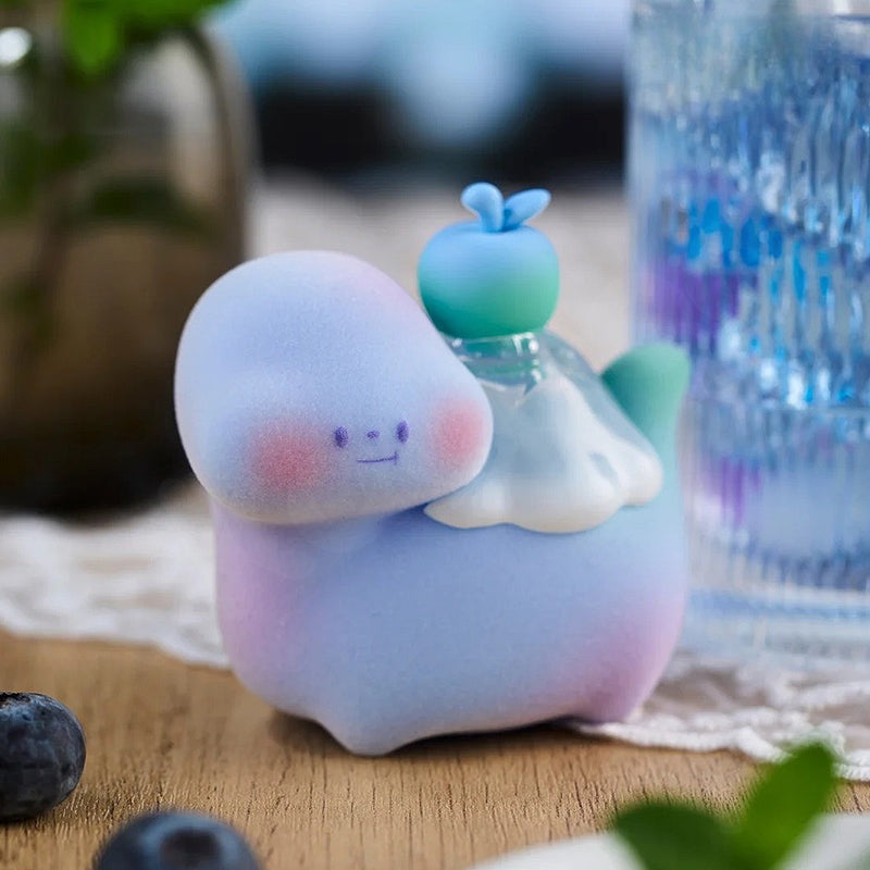Plush toy resembling a cartoon character on a wooden surface with a blurred background