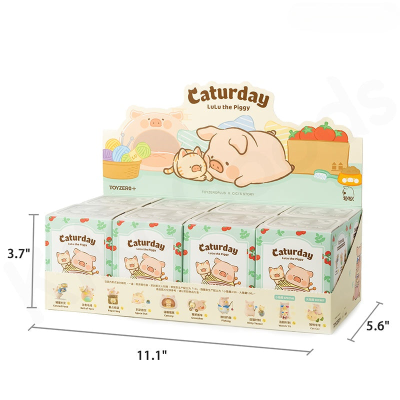 Display box of 'Caturday' toys featuring cartoon pigs with dimensions indicated.