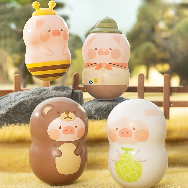 Four cute animal-themed figurines on a natural background