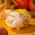 Ceramic piggy bank with decorative elements on a warm-toned background