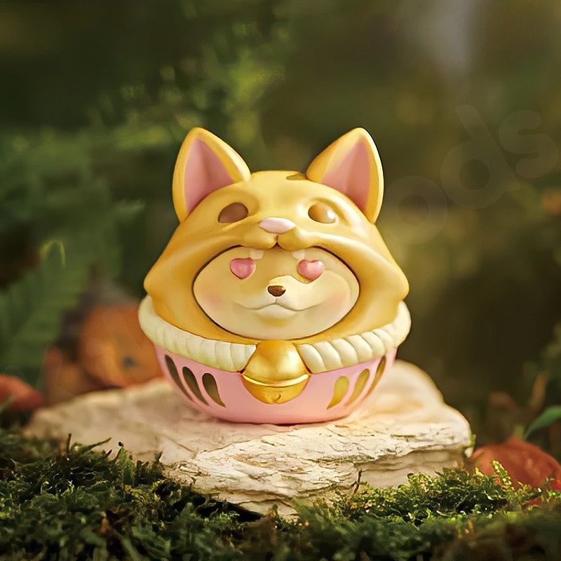Cute dog-shaped figurine with a gold and pink design on a natural background