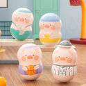 Four pig-shaped toys with different outfits on a wooden surface.