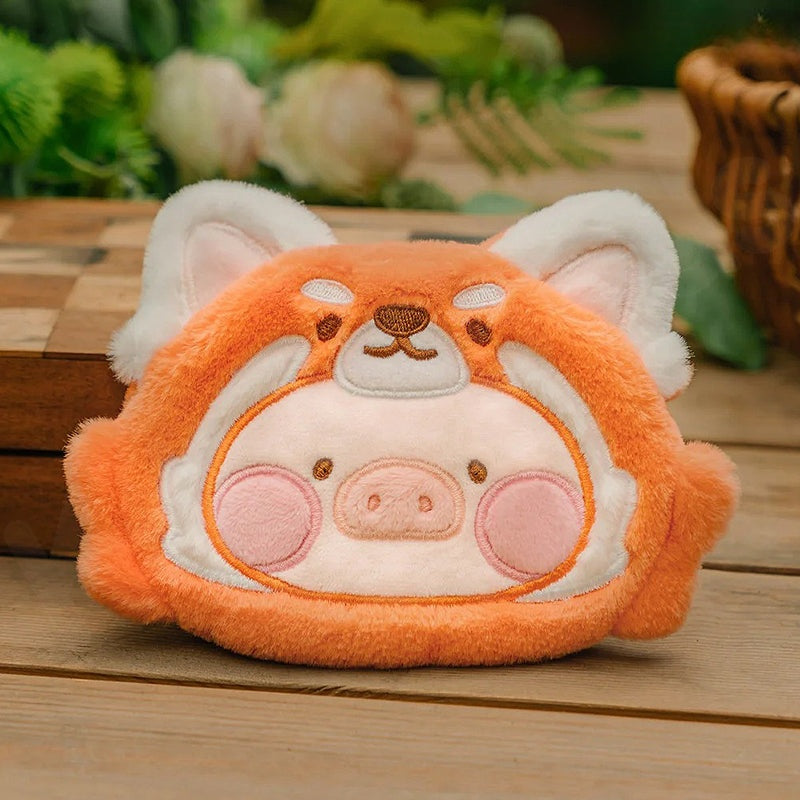 Plush toy with a pig design on a wooden surface