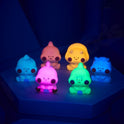 Colorful cartoon-like figures on a dark background