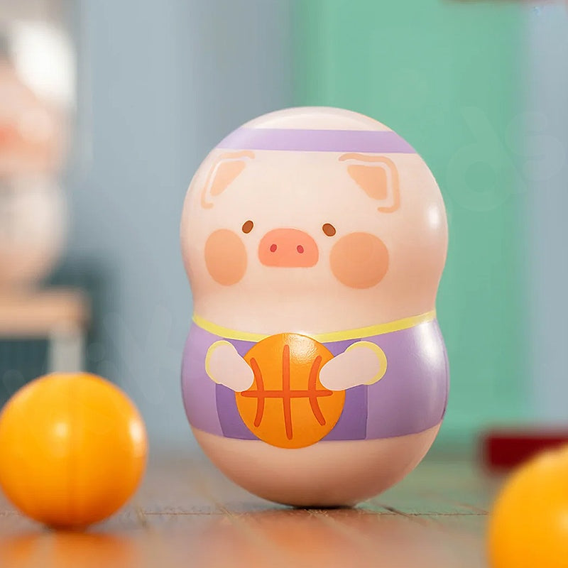 Toy piggy bank with basketball design on a blurred background