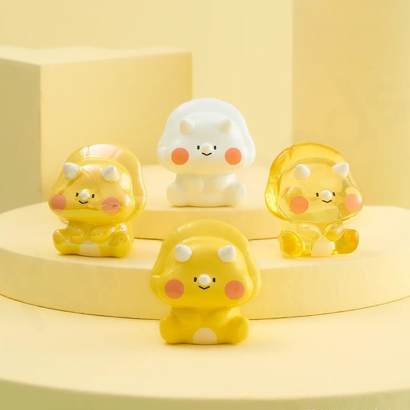 Set of four cartoon-like figurines with a yellow and white color scheme on a yellow background.