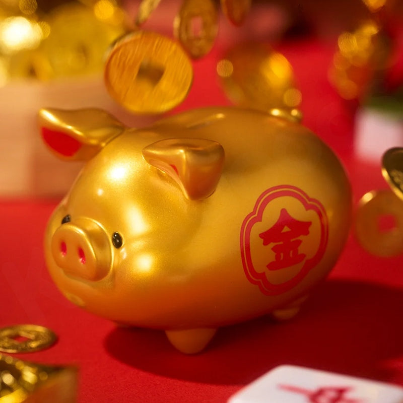 Gold piggy bank with Chinese characters on a red background