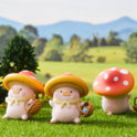 Three cartoonish mushroom characters with colorful hats on a grassy field with a scenic background.