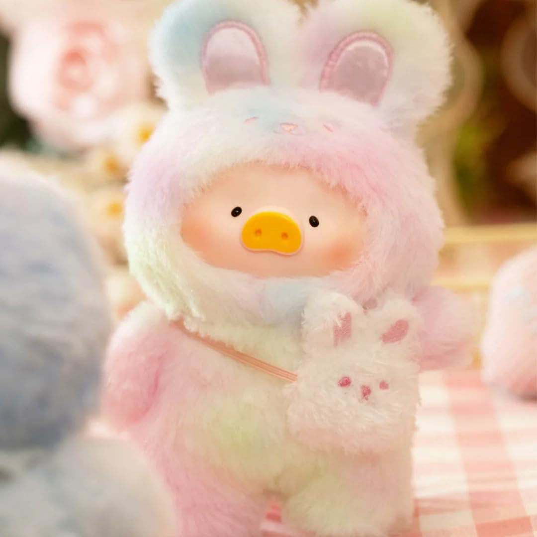 Plush toy with bunny ears and a smiling face, surrounded by soft focus background