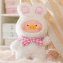 Cute plush toy with bunny ears and a bow tie on a soft background